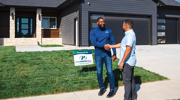 mortgage banking having discussion with young couple